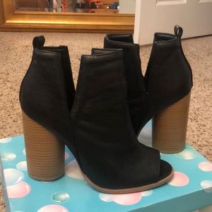 Black leather heeled booties with open toe